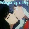 Kikyo kissing Inuyasha, 'Betrayed by a kiss' above them